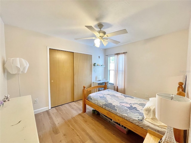 4370 NW 60th Ter, Gainesville, FL 32606 - bedroom featuring a closet, light wood-type flooring, a ceiling fan, and baseboards