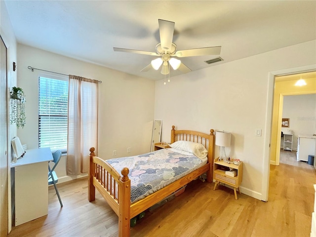 4370 NW 60th Ter, Gainesville, FL 32606 - bedroom featuring light wood-style floors, baseboards, and ceiling fan