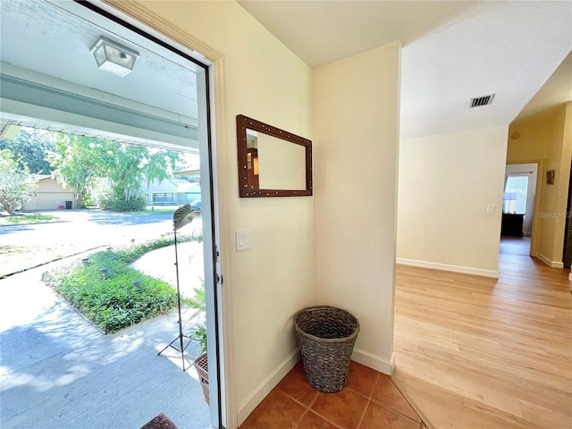4370 NW 60th Ter, Gainesville, FL 32606 - entryway featuring baseboards and light wood-type flooring