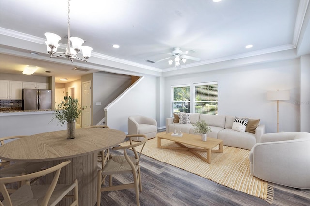 528 NW 39th Rd Unit 101, Gainesville, FL 32607 - living area featuring wood finished floors, a chandelier, recessed lighting, ornamental molding, and stairs