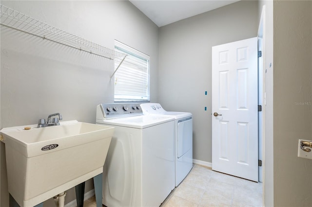 528 NW 39th Rd Unit 101, Gainesville, FL 32607 - laundry room with washer and dryer and light tile patterned floors