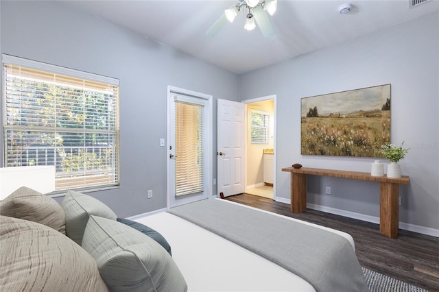 528 NW 39th Rd Unit 101, Gainesville, FL 32607 - bedroom with baseboards, wood finished floors, a ceiling fan, and access to exterior