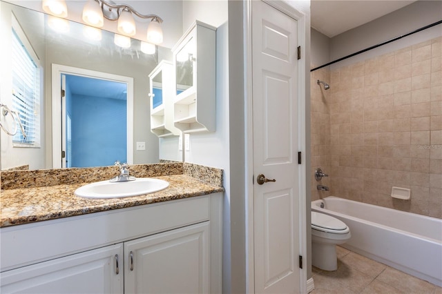 528 NW 39th Rd Unit 101, Gainesville, FL 32607 - full bathroom with toilet, tile patterned flooring, vanity, and shower / tub combination