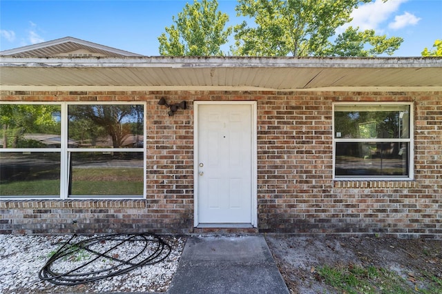 6117 NW 23rd Ter, Gainesville, FL 32653 - doorway to property with brick siding