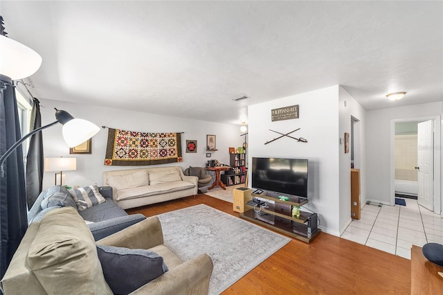 6117 NW 23rd Ter, Gainesville, FL 32653 - living room featuring wood finished floors and baseboards