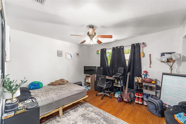 6117 NW 23rd Ter, Gainesville, FL 32653 - bedroom with wood finished floors and a ceiling fan