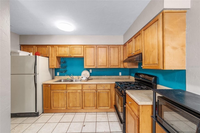 6117 NW 23rd Ter, Gainesville, FL 32653 - kitchen featuring black appliances, a sink, under cabinet range hood, light countertops, and light tile patterned floors