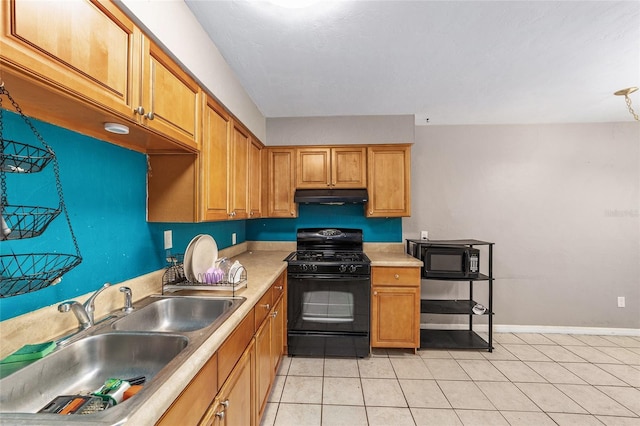 6117 NW 23rd Ter, Gainesville, FL 32653 - kitchen featuring black appliances, under cabinet range hood, a sink, and light tile patterned flooring