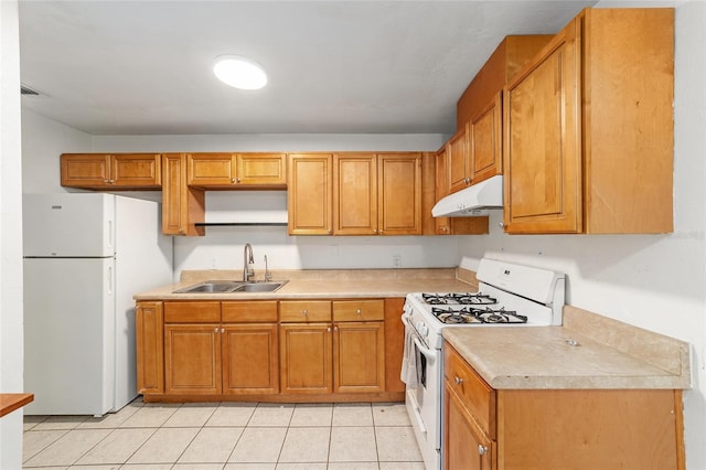 6117 NW 23rd Ter, Gainesville, FL 32653 - kitchen featuring white appliances, a sink, under cabinet range hood, light countertops, and light tile patterned flooring