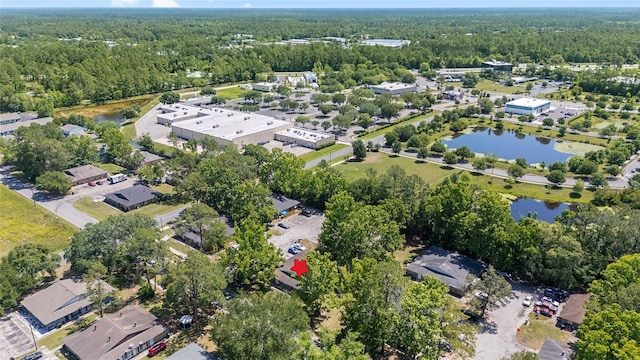 6117 NW 23rd Ter, Gainesville, FL 32653 - aerial view of property and surrounding area with a heavily wooded area and a large body of water