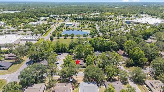 6117 NW 23rd Ter, Gainesville, FL 32653 - aerial overview of property's location with a forest, nearby suburban area, and a large body of water