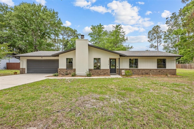 3215 NW 68th Ave, Gainesville, FL 32653 - mid-century modern home featuring brick siding, a garage, driveway, and a chimney
