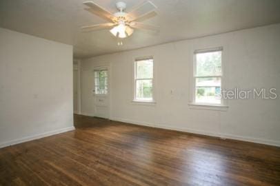1627 NW 8th Ave, Gainesville, FL 32603 - spare room with baseboards, wood finished floors, and a ceiling fan