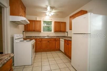 1627 NW 8th Ave, Gainesville, FL 32603 - kitchen featuring white appliances, under cabinet range hood, ceiling fan, and brown cabinets