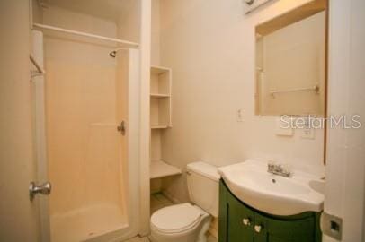 1627 NW 8th Ave, Gainesville, FL 32603 - bathroom featuring a shower stall, vanity, and toilet