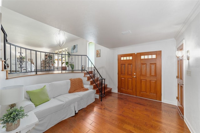 6015 SW 36th Way, Gainesville, FL 32608 - foyer featuring wood-type flooring, crown molding, stairway, and baseboards