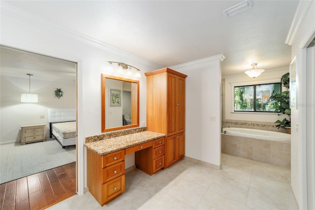 6015 SW 36th Way, Gainesville, FL 32608 - full bath with ensuite bathroom, a garden tub, crown molding, baseboards, and vanity