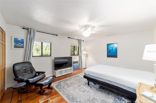 6015 SW 36th Way, Gainesville, FL 32608 - bedroom featuring wood finished floors, baseboards, and a ceiling fan