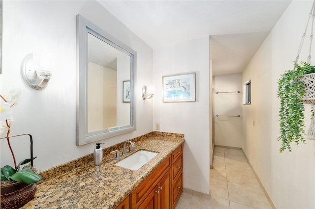 6015 SW 36th Way, Gainesville, FL 32608 - bathroom with vanity, tile patterned floors, and baseboards