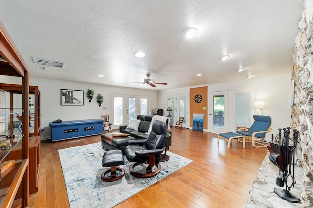 6015 SW 36th Way, Gainesville, FL 32608 - living room featuring healthy amount of natural light, hardwood / wood-style floors, ceiling fan, french doors, and recessed lighting