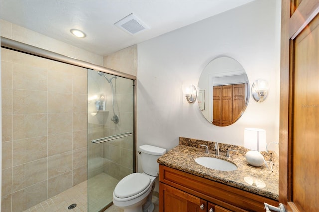 6015 SW 36th Way, Gainesville, FL 32608 - bathroom featuring vanity, toilet, and a stall shower