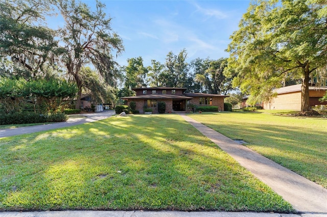 6015 SW 36th Way, Gainesville, FL 32608 - view of front of home featuring a front lawn and brick siding