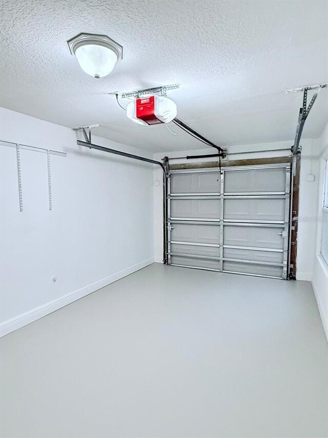 1425 S Central Ave, Flagler Beach, FL 32136 - garage featuring a garage door opener and baseboards
