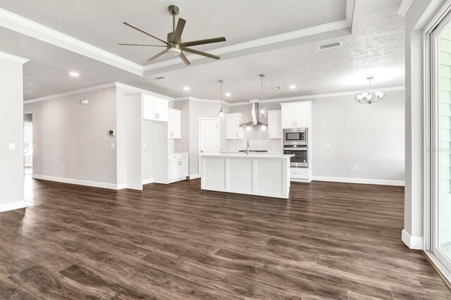 6669 SW 10th Ln, Gainesville, FL 32607 - kitchen featuring wall chimney range hood, appliances with stainless steel finishes, a ceiling fan, recessed lighting, and a chandelier