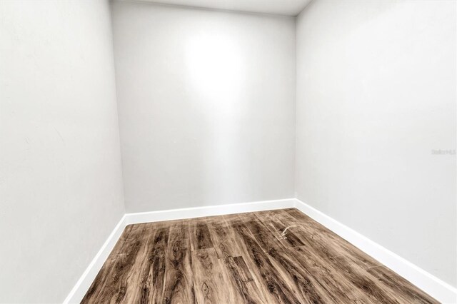 6669 SW 10th Ln, Gainesville, FL 32607 - unfurnished room featuring dark wood finished floors and baseboards