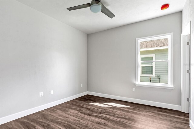 6669 SW 10th Ln, Gainesville, FL 32607 - unfurnished room with ceiling fan, dark wood-style floors, and baseboards