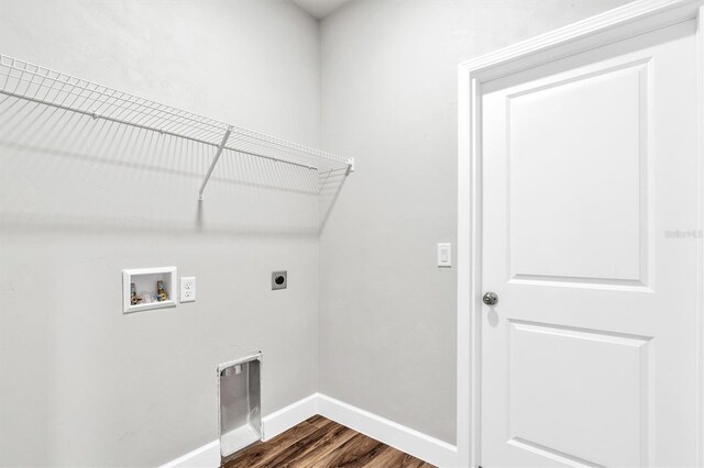 6669 SW 10th Ln, Gainesville, FL 32607 - laundry room featuring washer hookup, electric dryer hookup, dark wood finished floors, and baseboards