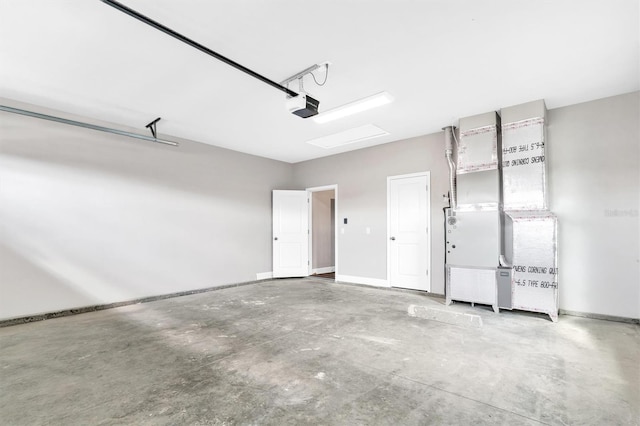 6669 SW 10th Ln, Gainesville, FL 32607 - garage featuring a garage door opener, baseboards, and heating unit