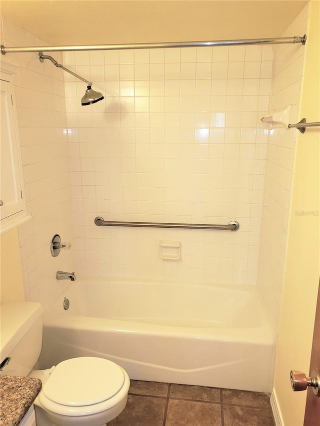 2360 SW Archer Rd Unit 404, Gainesville, FL 32608 - bathroom featuring toilet, tile patterned flooring, and shower / bath combination