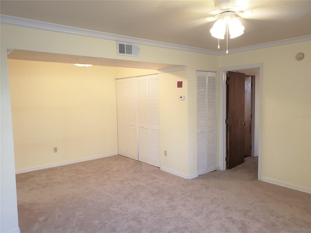 2360 SW Archer Rd Unit 404, Gainesville, FL 32608 - unfurnished bedroom featuring carpet, crown molding, and baseboards