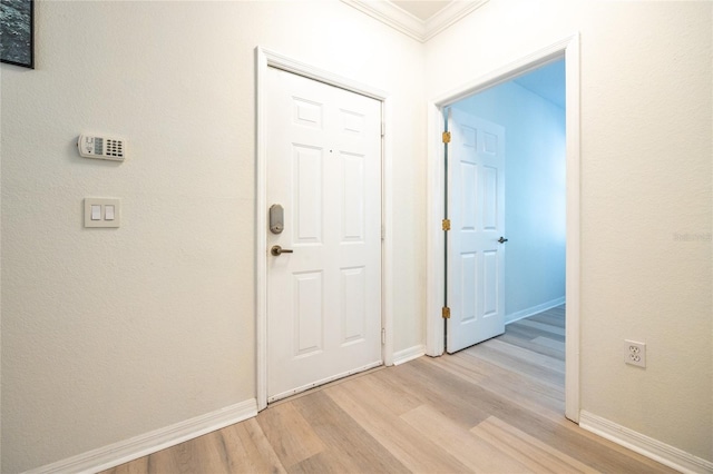 4850 SW 91st Ter Unit P201, Gainesville, FL 32608 - foyer featuring ornamental molding, light wood-style floors, and baseboards