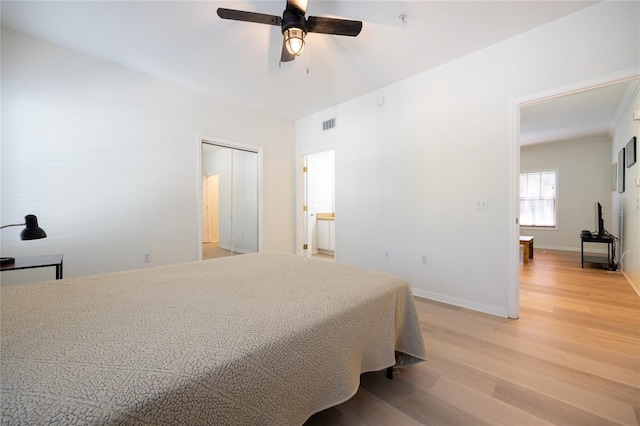 4850 SW 91st Ter Unit P201, Gainesville, FL 32608 - bedroom featuring light wood finished floors, baseboards, and a ceiling fan