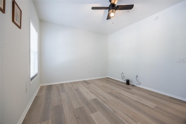 4850 SW 91st Ter Unit P201, Gainesville, FL 32608 - spare room featuring light wood-style floors, ceiling fan, and baseboards