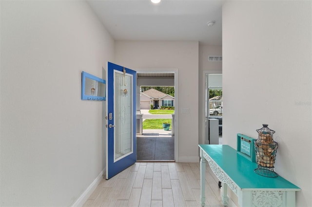 24624 NW 7th Ln, Newberry, FL 32669 - foyer entrance featuring baseboards and light wood finished floors