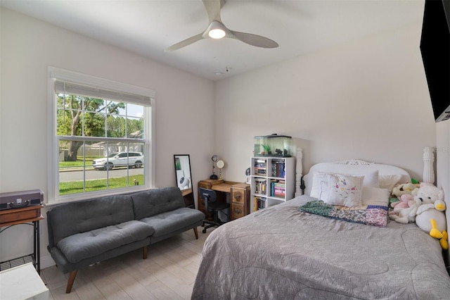 24624 NW 7th Ln, Newberry, FL 32669 - bedroom with light wood-type flooring and ceiling fan