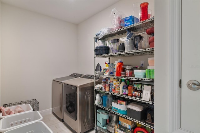 24624 NW 7th Ln, Newberry, FL 32669 - laundry room with washer and dryer, wood finished floors, and baseboards