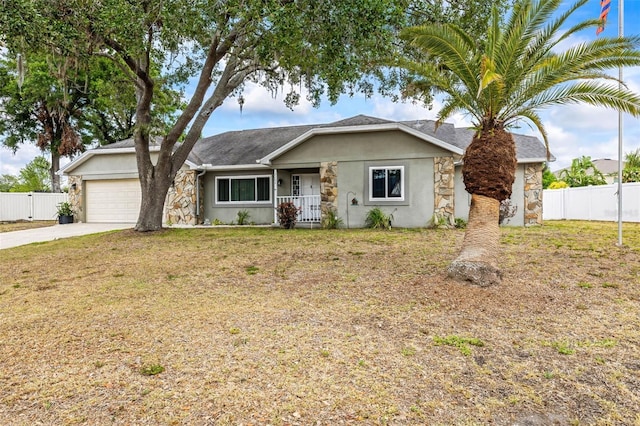 2204 Krista Ln, Brandon, FL 33511 - view of front of property with an attached garage, driveway, stucco siding, and stone siding