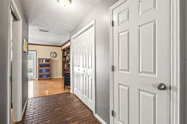 2204 Krista Ln, Brandon, FL 33511 - corridor featuring brick floors, baseboards, ornamental molding, and wood walls