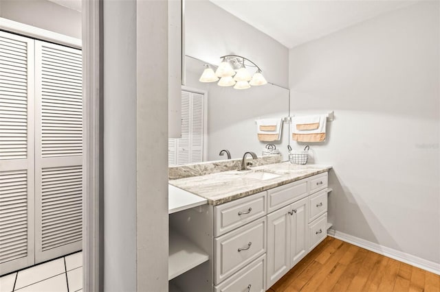 2204 Krista Ln, Brandon, FL 33511 - bathroom with vanity, a closet, baseboards, and wood finished floors