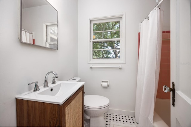 1617 NE 8th St, Gainesville, FL 32609 - full bathroom with vanity, toilet, shower / tub combo, and baseboards