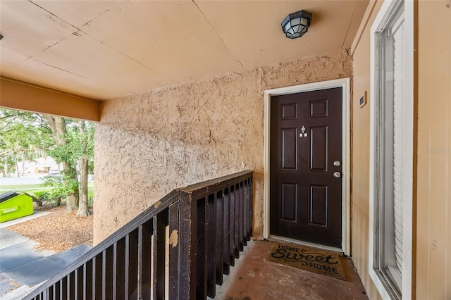 1810 NW 23rd Blvd Unit 203, Gainesville, FL 32605 - doorway to property featuring stucco siding