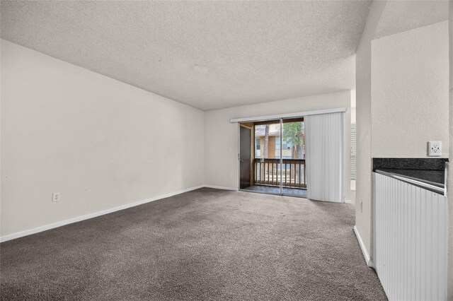 1810 NW 23rd Blvd Unit 203, Gainesville, FL 32605 - unfurnished room featuring a textured ceiling, carpet flooring, and baseboards