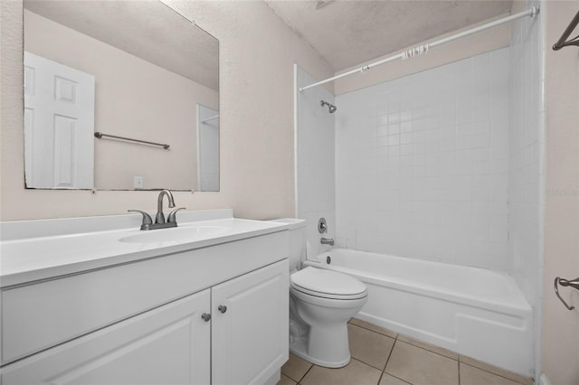 1810 NW 23rd Blvd Unit 203, Gainesville, FL 32605 - full bathroom featuring vanity, toilet, tile patterned flooring, shower / washtub combination, and a textured ceiling