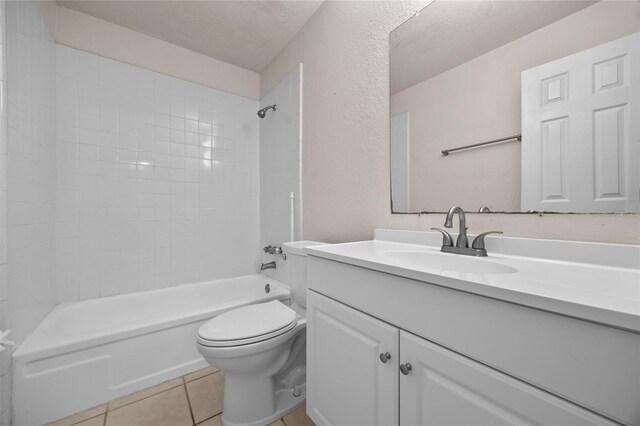 1810 NW 23rd Blvd Unit 203, Gainesville, FL 32605 - full bath with vanity, toilet, shower / washtub combination, tile patterned flooring, and a textured wall