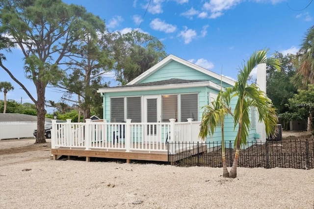 915 S Broadway Unit Ab, Englewood, FL 34223 - back of property featuring a deck and a chimney