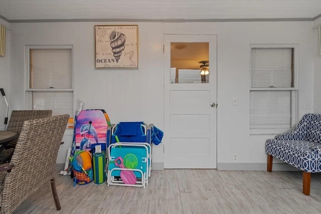 915 S Broadway Unit Ab, Englewood, FL 34223 - game room with wood finished floors, ornamental molding, and baseboards